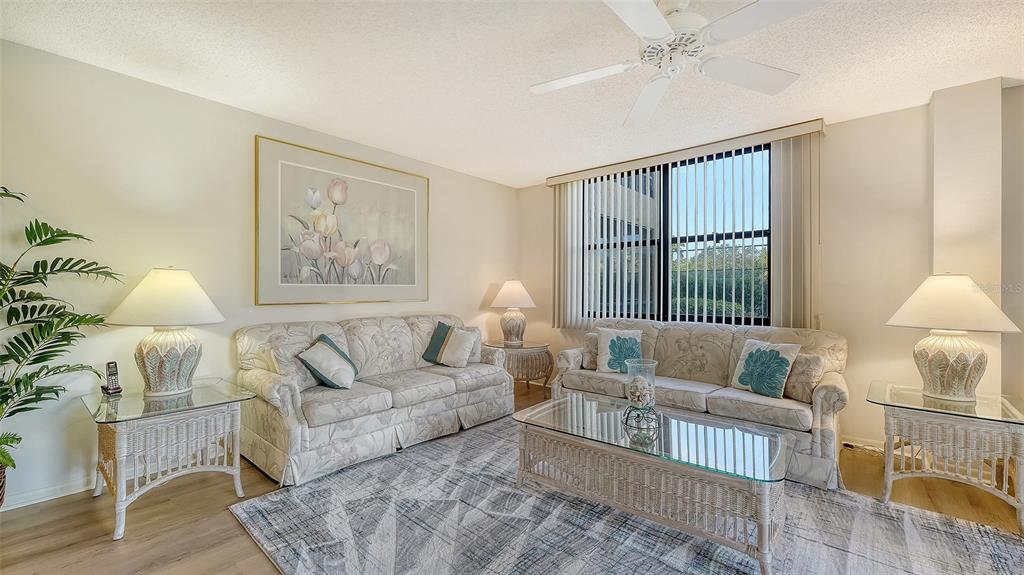 8773 Midnight Pass Road, Unit 102G Sarasota, FL 34242 - Photo 8 of 79 a living room with furniture and a window