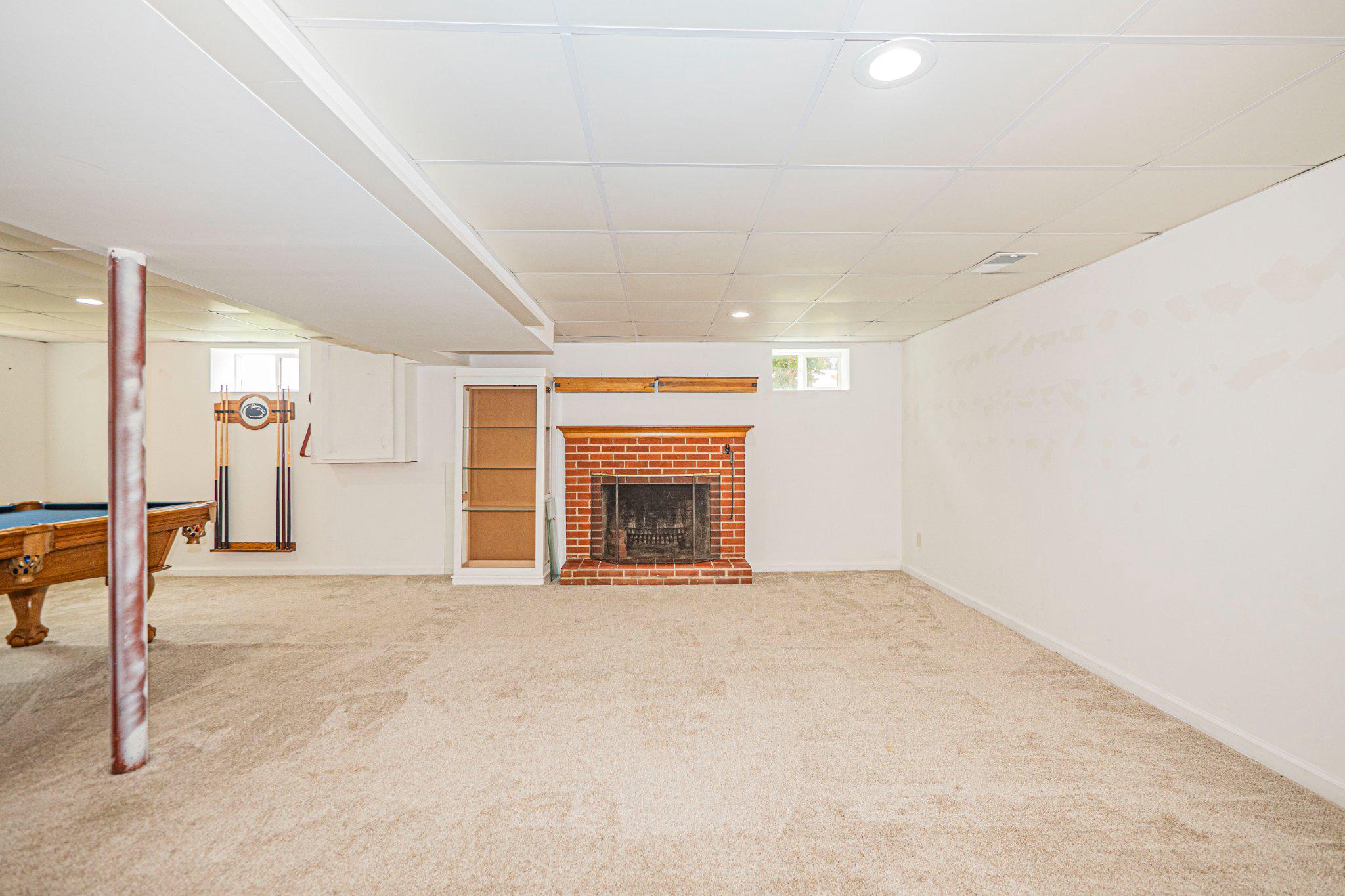 9907 Forge Park Road Perry Hall, MD 21128 - Photo 33 of 36 Spacious basement with cozy fireplace.