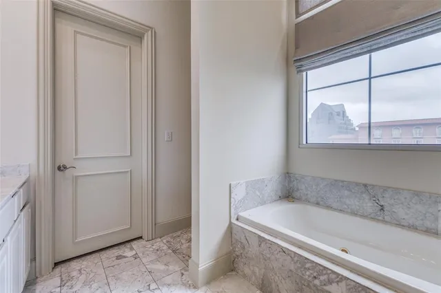 a bath tub sitting next to a window