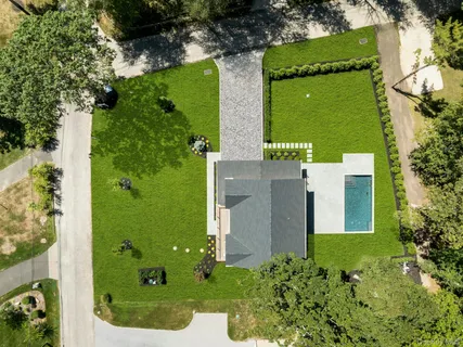 a kitchen with a sink cabinets and wooden floor