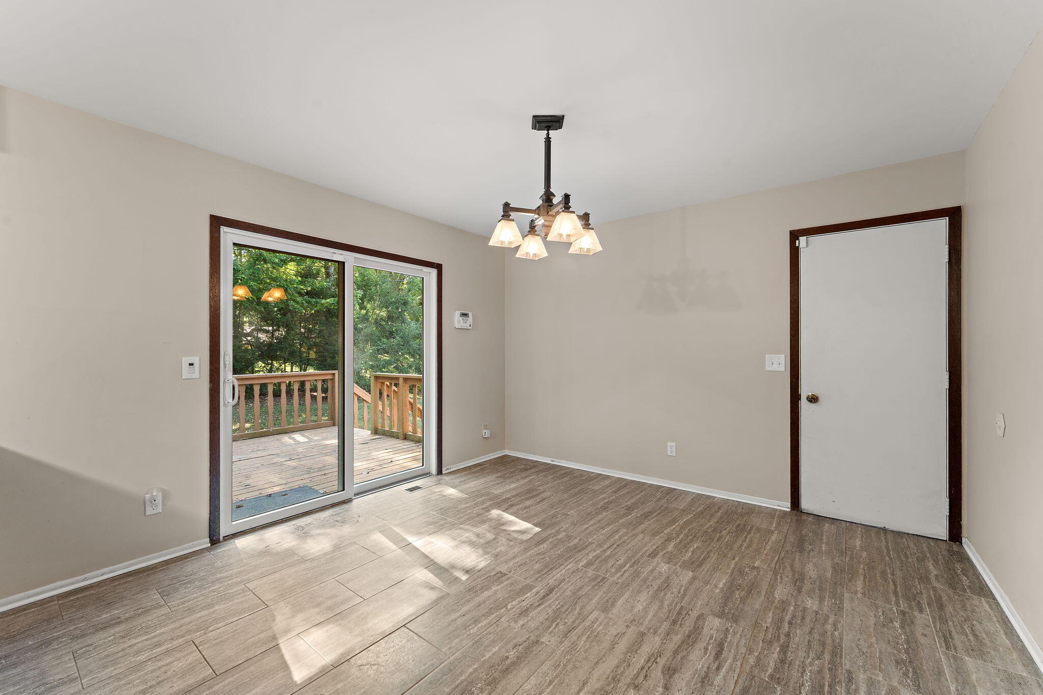 586 Fargo Road Westville, IN 46391 - Photo 12 of 40 an empty room with wooden floor and windows