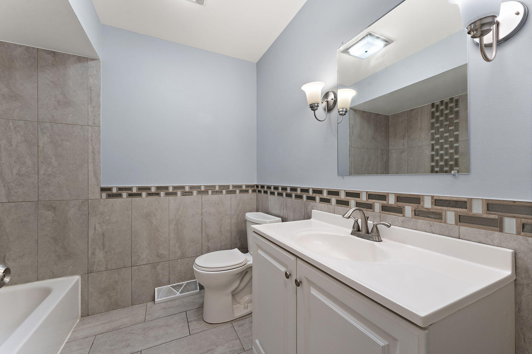 586 Fargo Road Westville, IN 46391 - Photo 13 of 40 a bathroom with a sink a toilet and a mirror