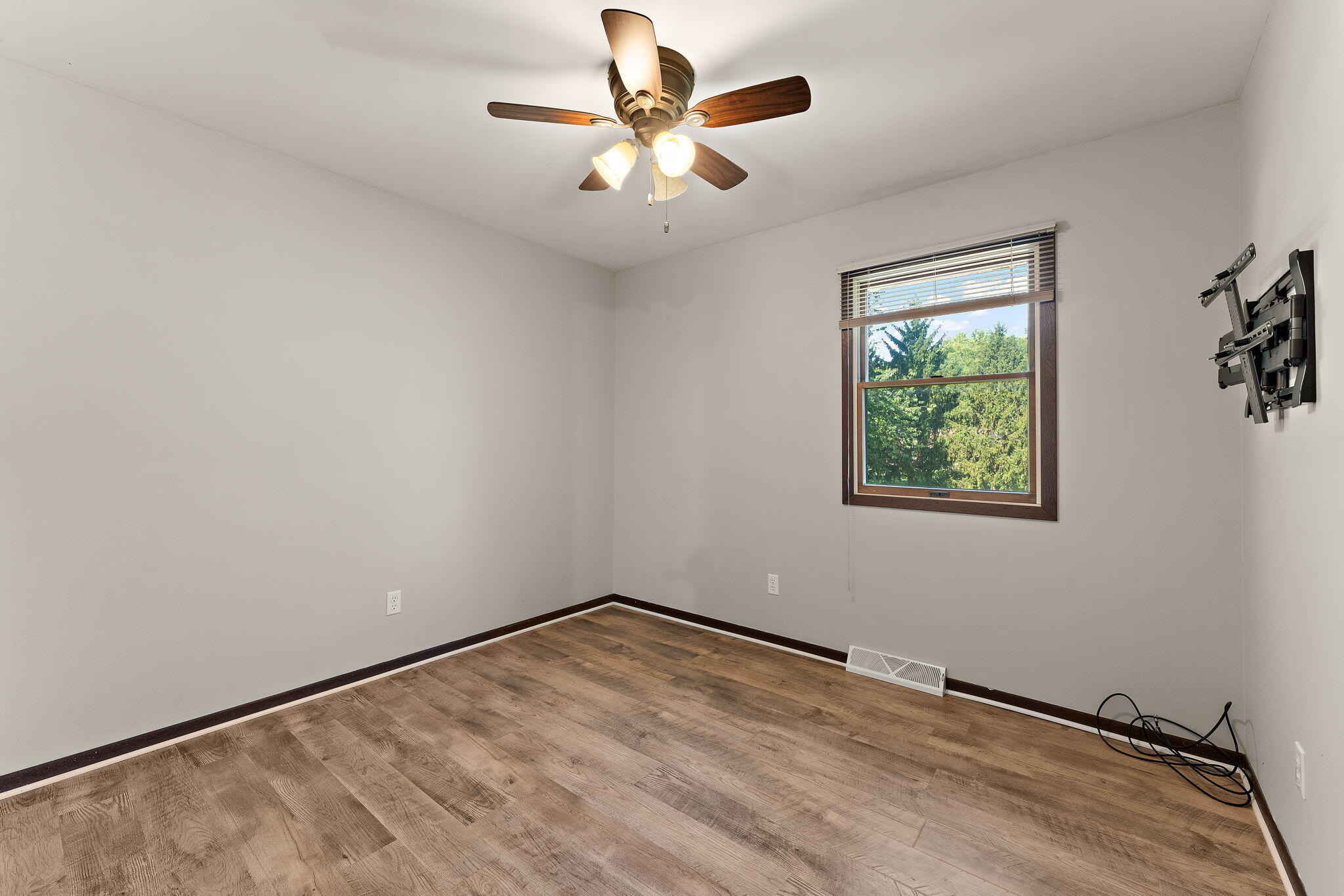 586 Fargo Road Westville, IN 46391 - Photo 15 of 40 an empty room with a window and a ceiling fan