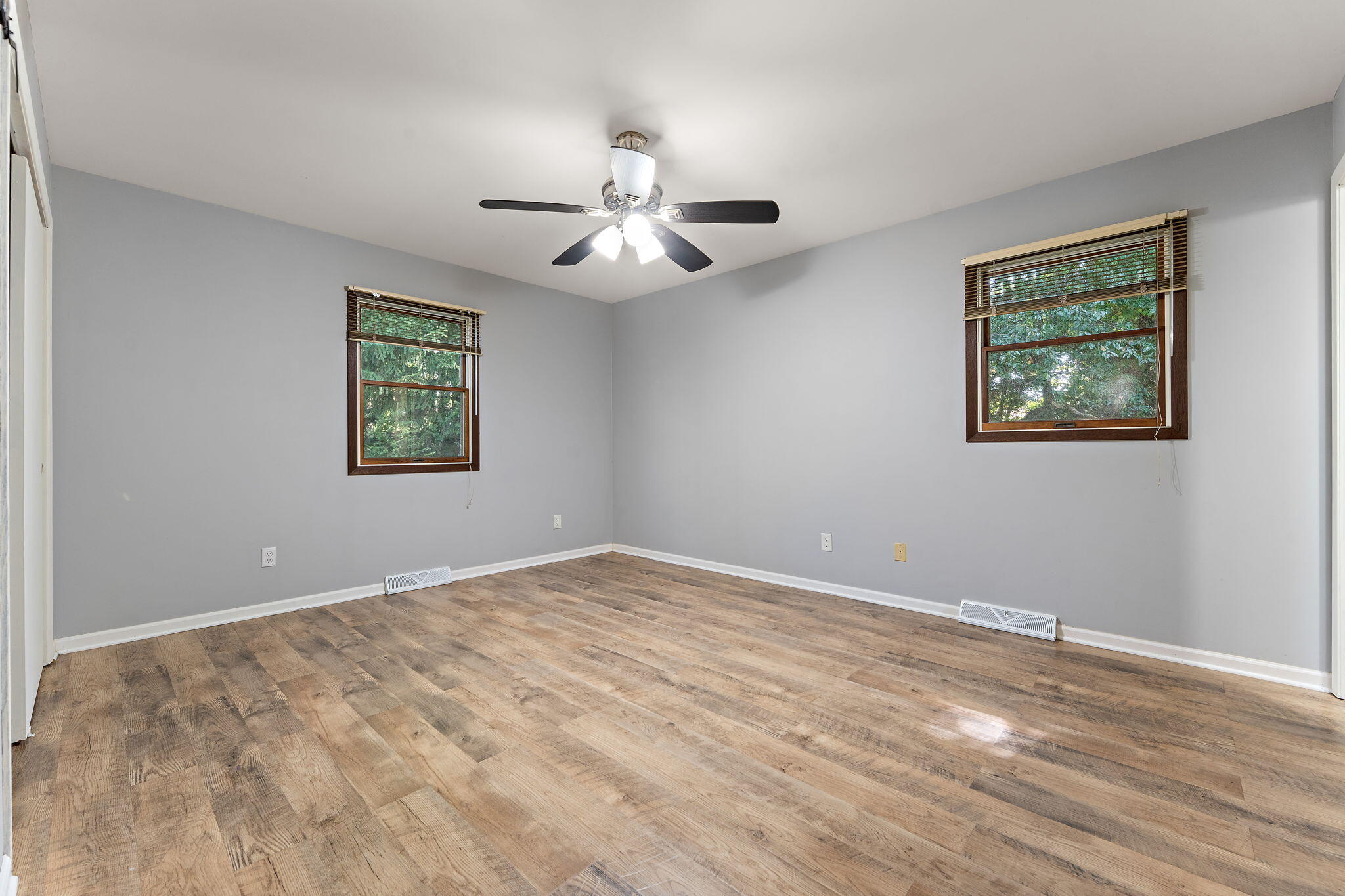 586 Fargo Road Westville, IN 46391 - Photo 17 of 40 a view of an empty room with a window and a chandelier fan