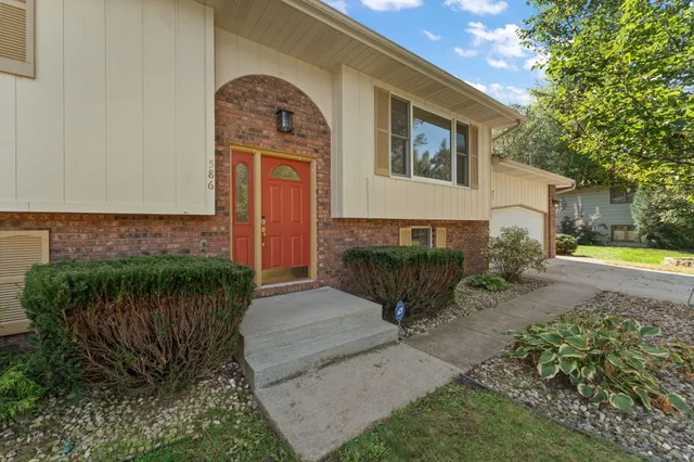 a front view of a house with garden