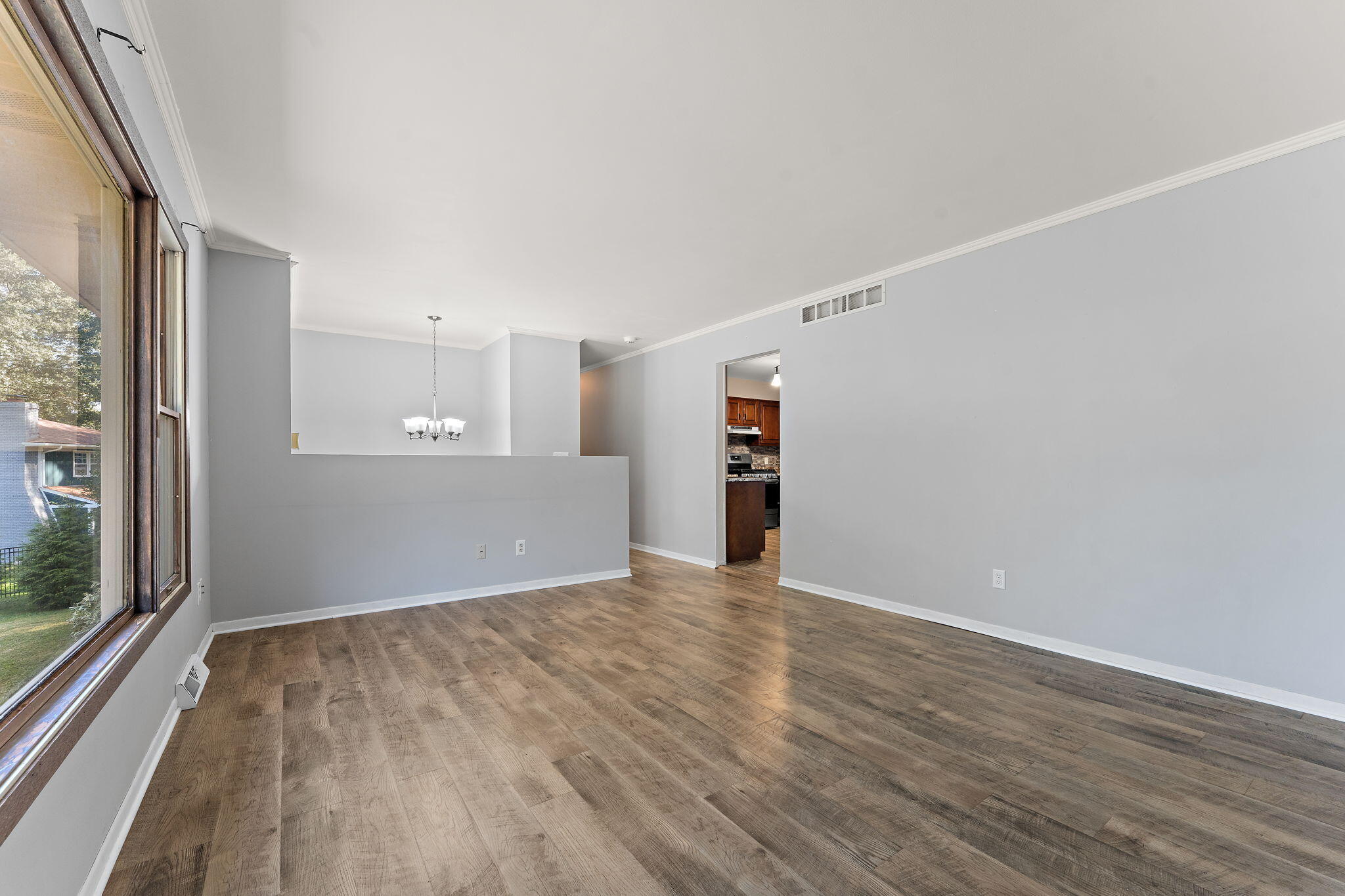 586 Fargo Road Westville, IN 46391 - Photo 6 of 40 a view of empty room with wooden floor and fan