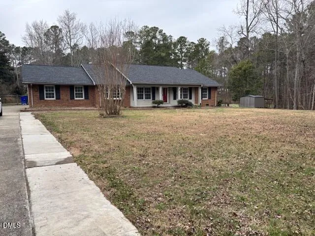 a front view of a house with yard