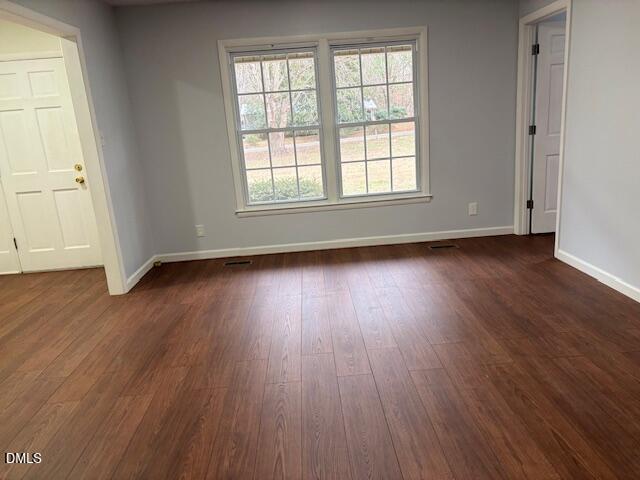 1208 Hatch Road Chapel Hill, NC 27516 - Photo 12 of 33 an empty room with wooden floor and windows