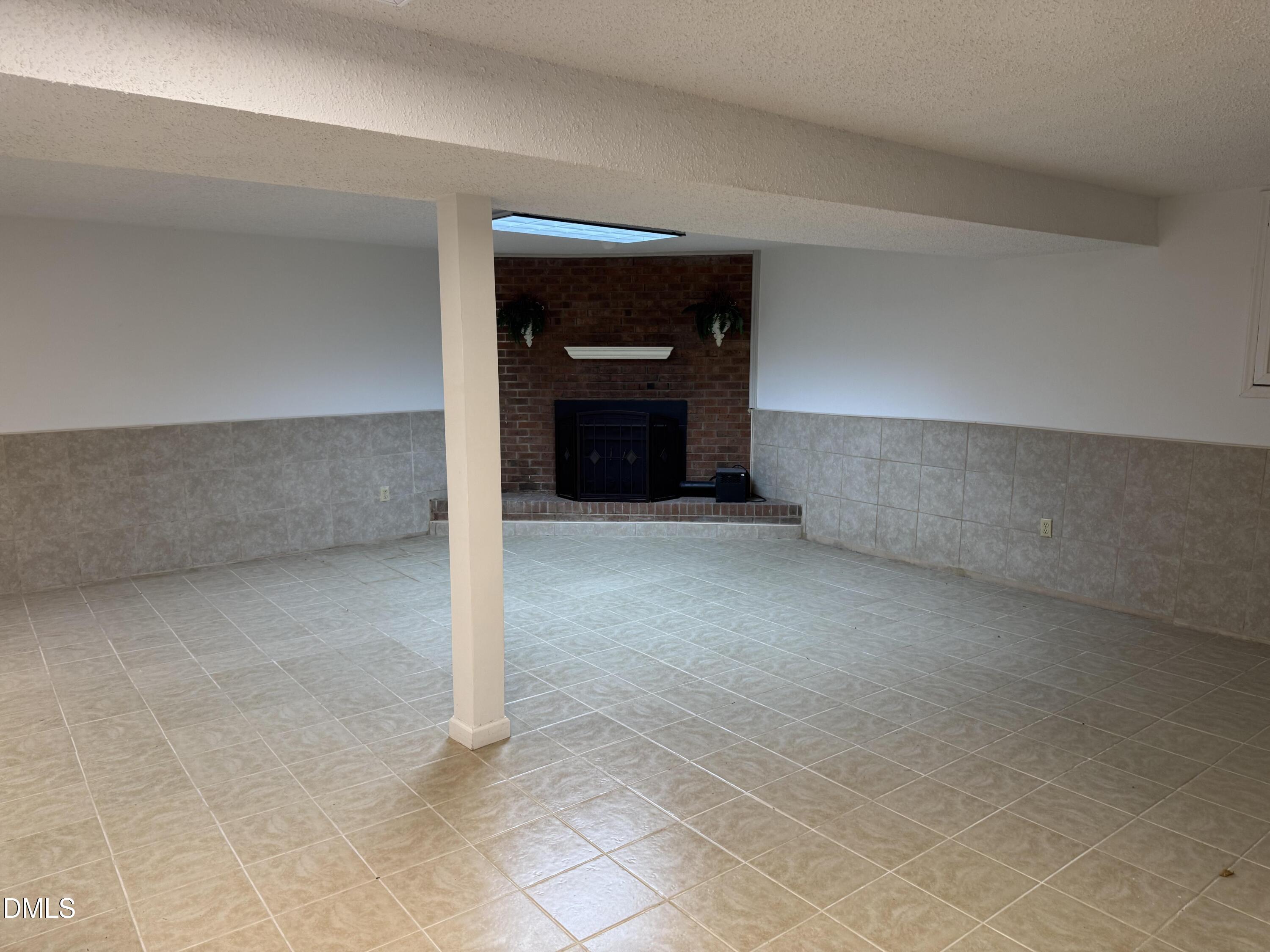 1208 Hatch Road Chapel Hill, NC 27516 - Photo 22 of 33 a view of an empty room and fire place