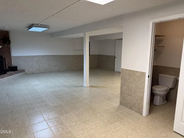 a kitchen with cabinets and window