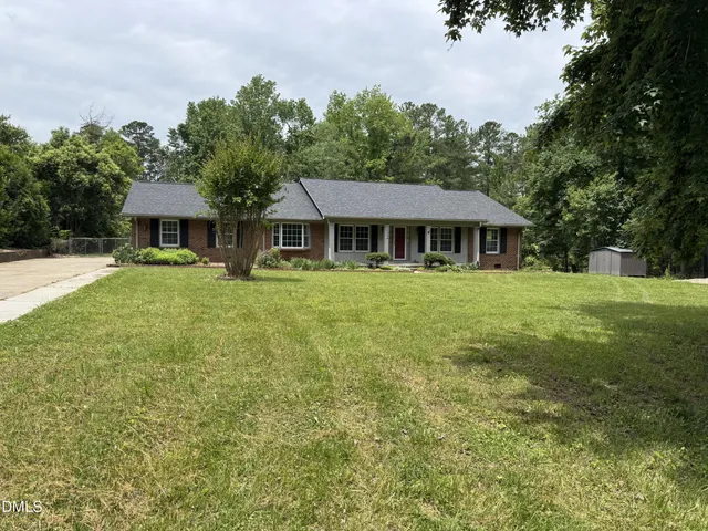 a brick house with a yard