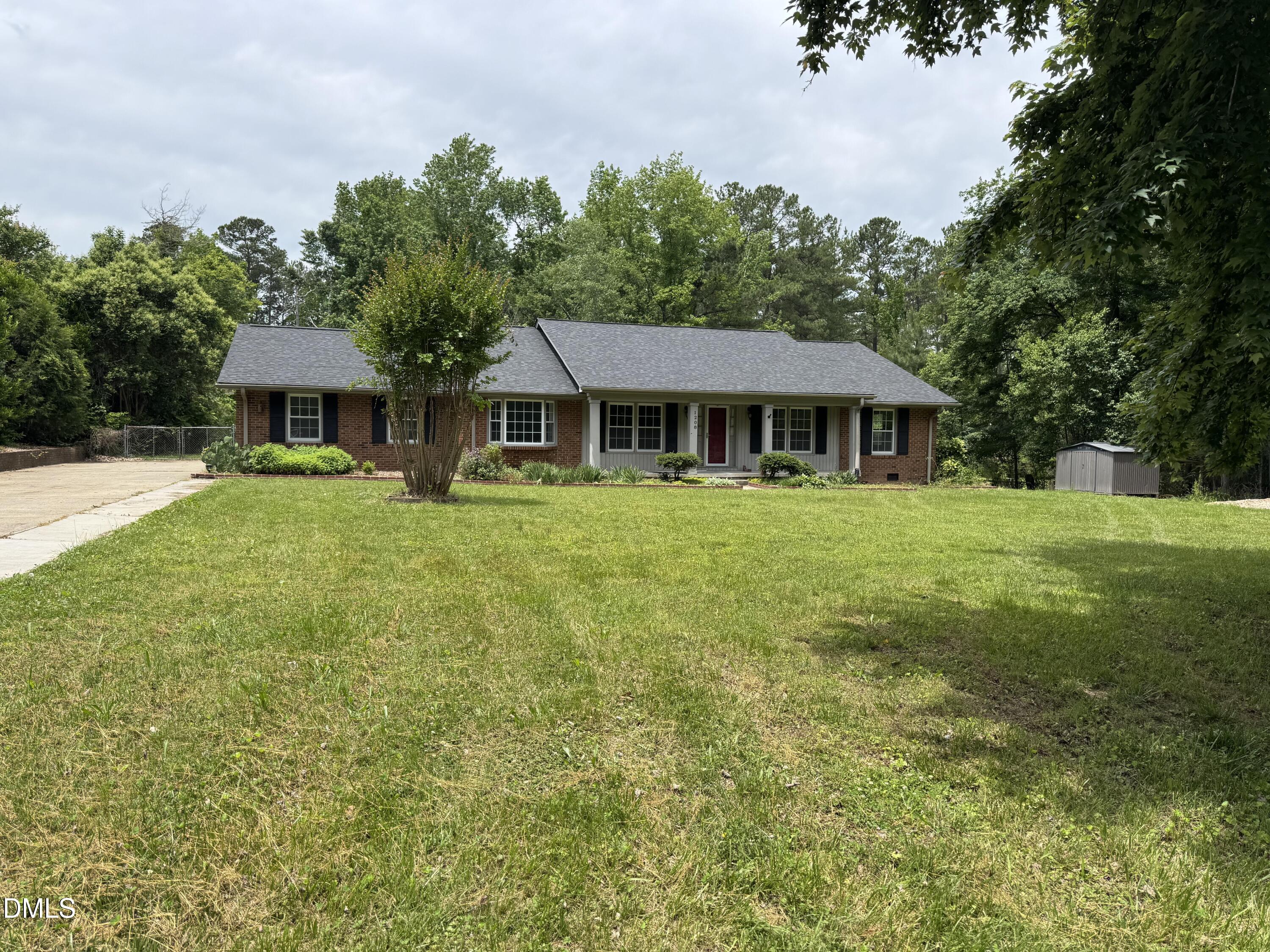 1208 Hatch Road Chapel Hill, NC 27516 - Photo 27 of 33 a house view with a garden space