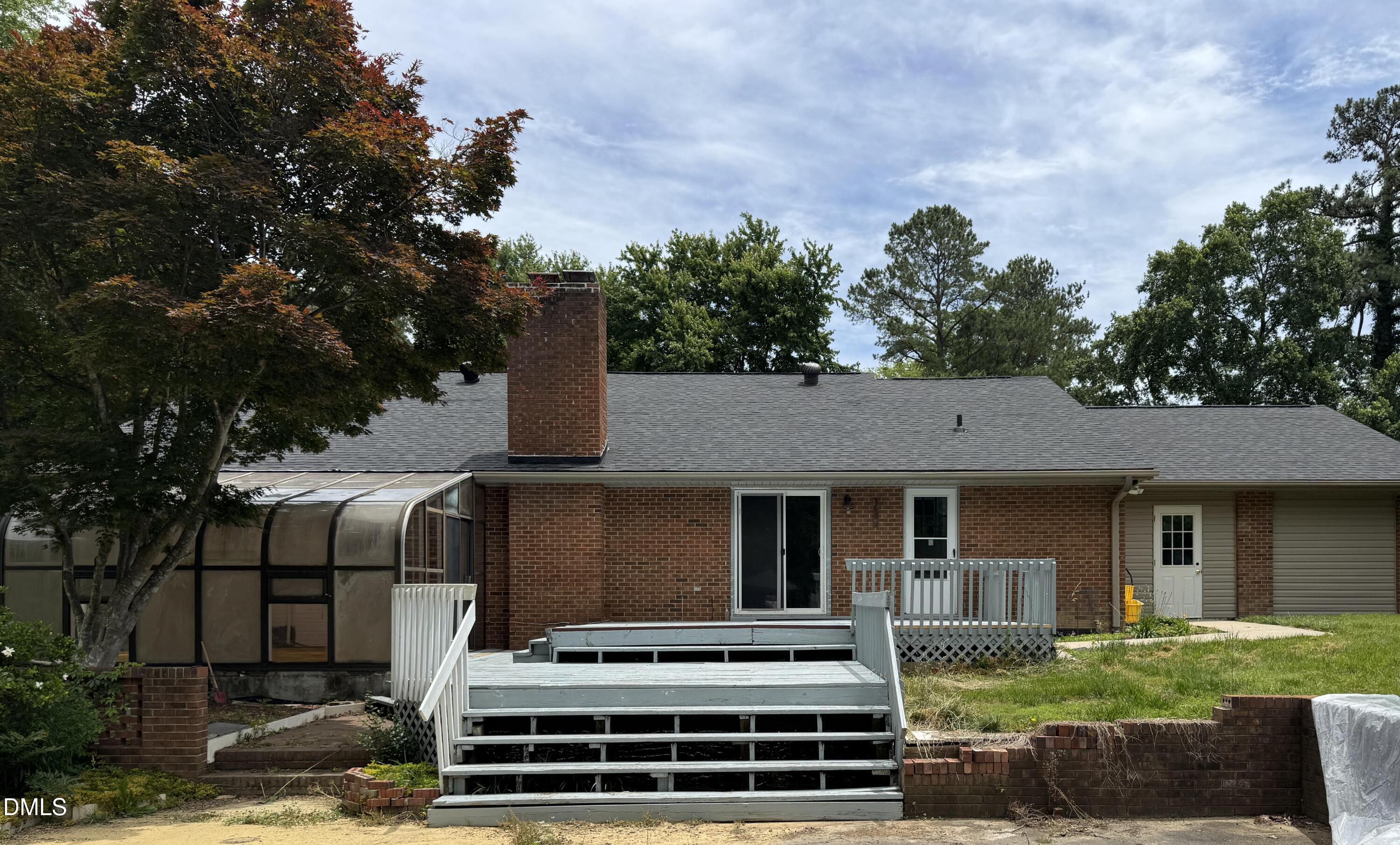 1208 Hatch Road Chapel Hill, NC 27516 - Photo 29 of 33 a front view of a house with a garden