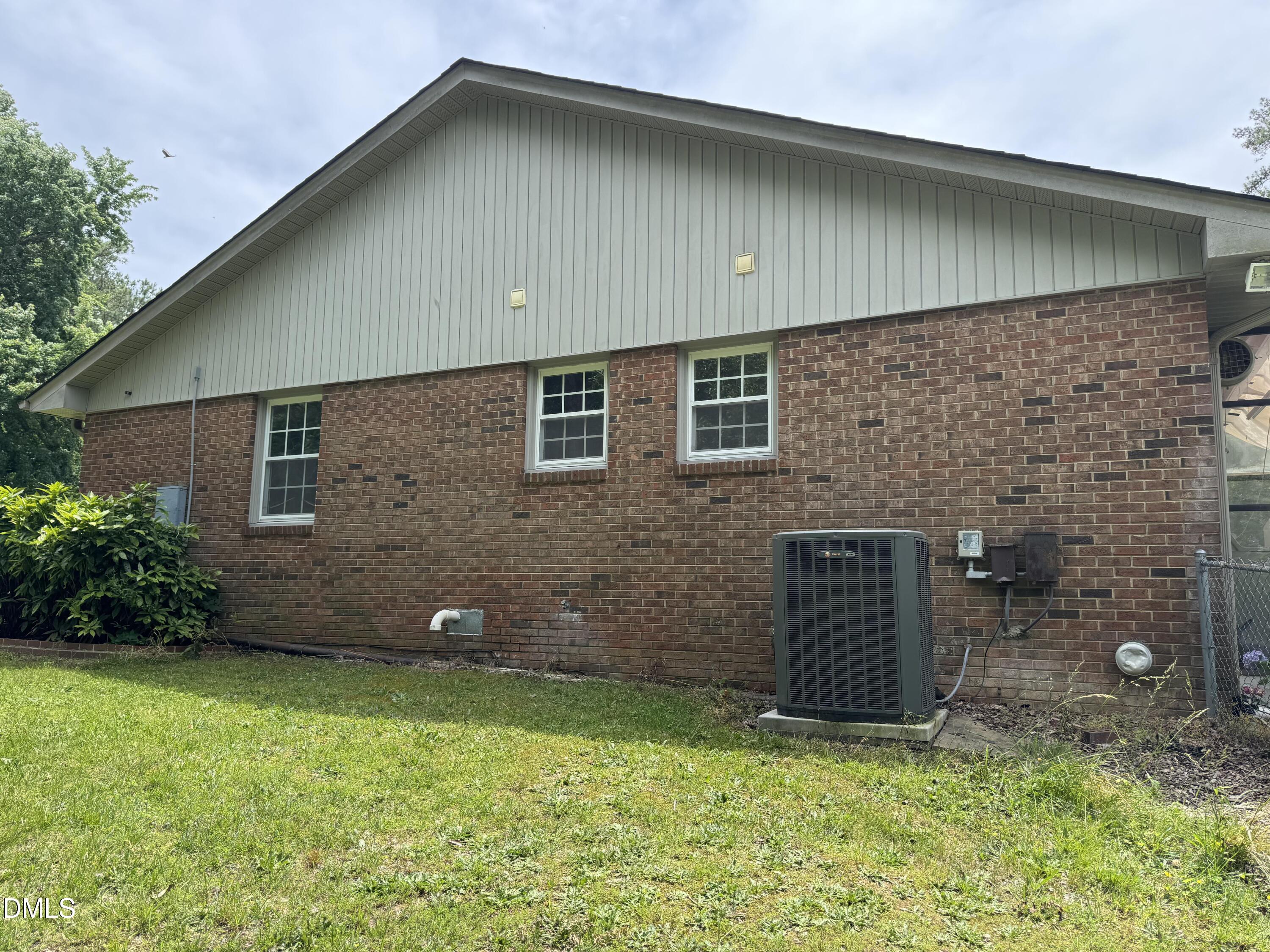 1208 Hatch Road Chapel Hill, NC 27516 - Photo 30 of 33 a brick house with a yard