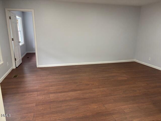 1208 Hatch Road Chapel Hill, NC 27516 - Photo 10 of 33 a view of an empty room and wooden floor