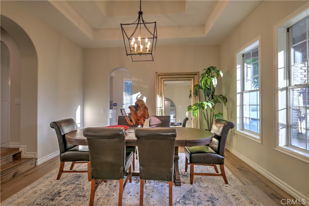 1016 Briarcliff Road Monrovia, CA 91016 - Photo 13 of 70 a view of a dining room with furniture a chandelier and wooden floor
