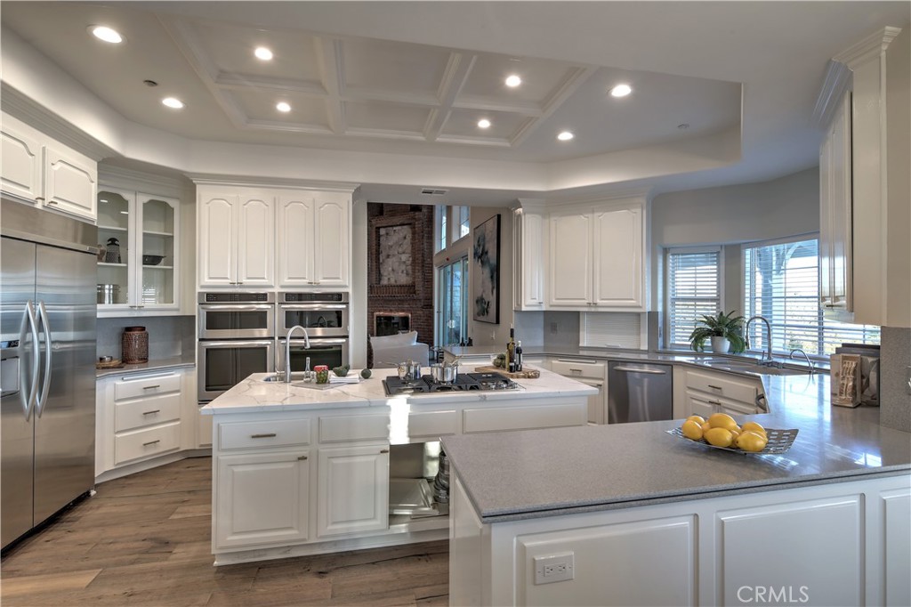 1016 Briarcliff Road Monrovia, CA 91016 - Photo 16 of 70 a kitchen that has a lot of cabinets in it and wooden floors