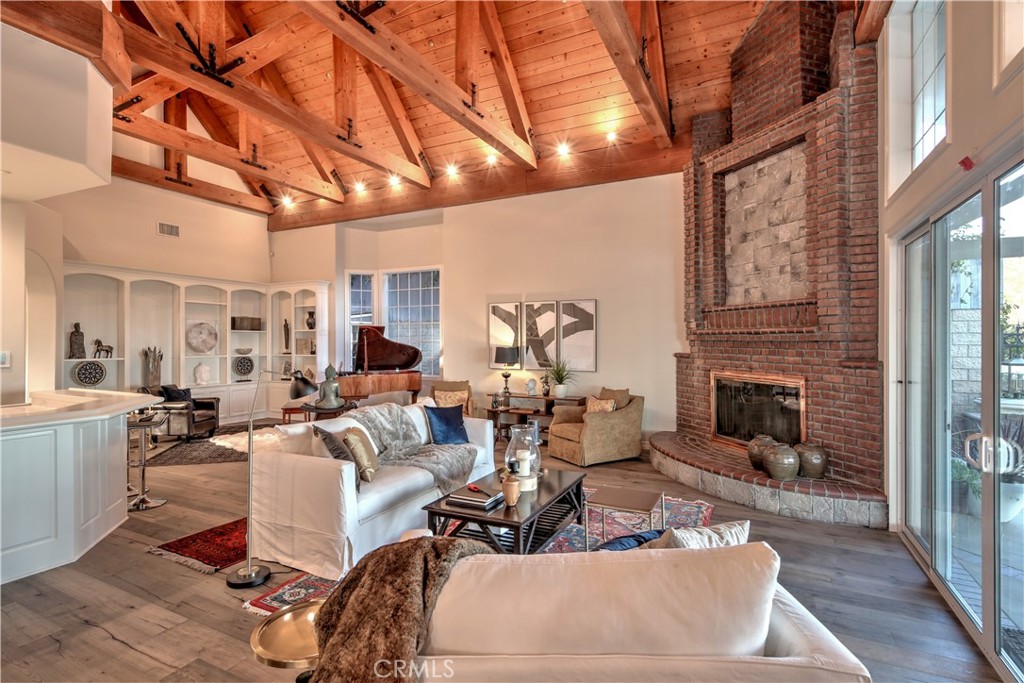 1016 Briarcliff Road Monrovia, CA 91016 - Photo 21 of 70 a living room with furniture a fireplace and a table