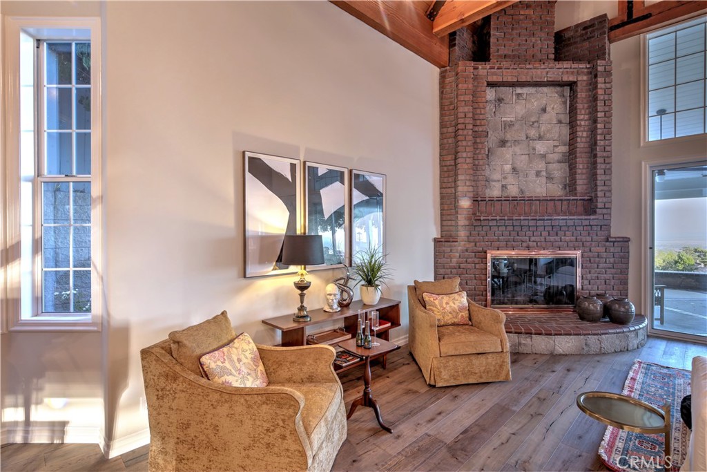 1016 Briarcliff Road Monrovia, CA 91016 - Photo 23 of 70 a living room with furniture and a fireplace