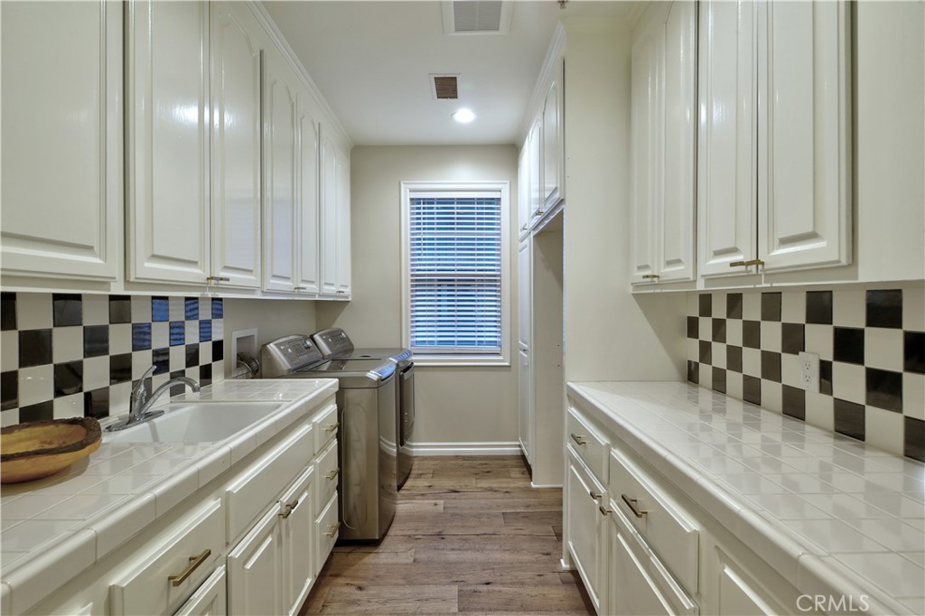 1016 Briarcliff Road Monrovia, CA 91016 - Photo 29 of 70 a kitchen with a sink and cabinets