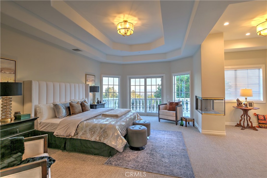 1016 Briarcliff Road Monrovia, CA 91016 - Photo 36 of 70 a bedroom with a bed and large windows