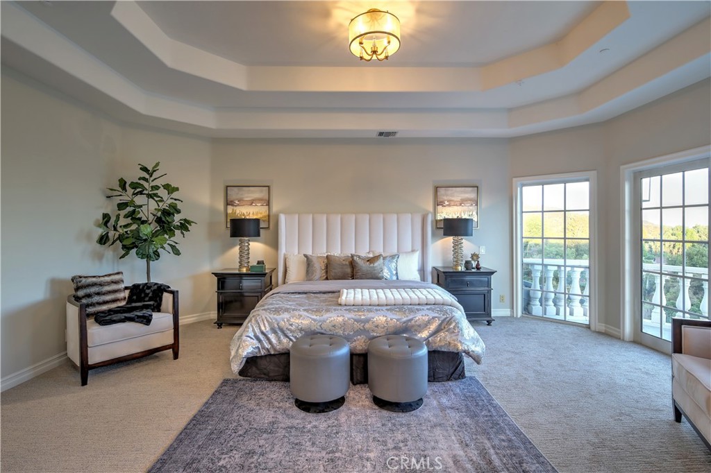 1016 Briarcliff Road Monrovia, CA 91016 - Photo 37 of 70 a living room with furniture a chandelier and a fireplace
