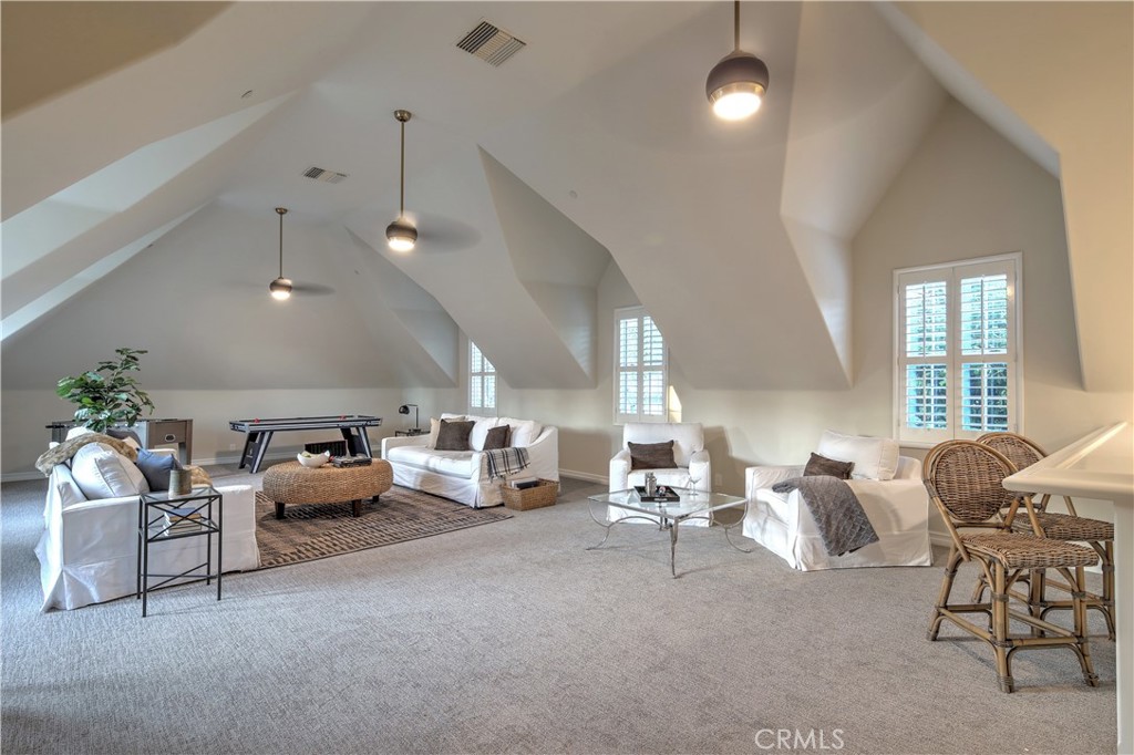 1016 Briarcliff Road Monrovia, CA 91016 - Photo 51 of 70 a living room with furniture and a chandelier