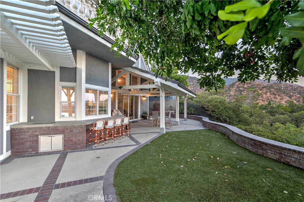 1016 Briarcliff Road Monrovia, CA 91016 - Photo 56 of 70 a view of a house with backyard sitting area and garden