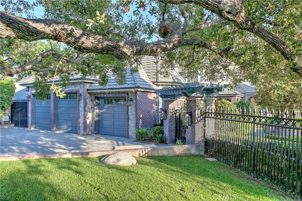 1016 Briarcliff Road Monrovia, CA 91016 - Photo 65 of 70 a view of a house with a small yard and a large tree