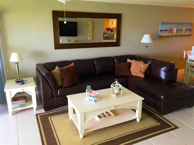 a dining room with furniture and chandelier