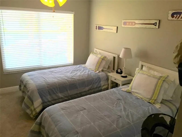 a swimming pool with outdoor seating and yard