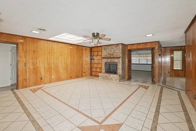 a view of an empty room with glass door