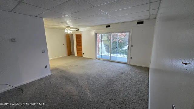 a view of empty room with windows
