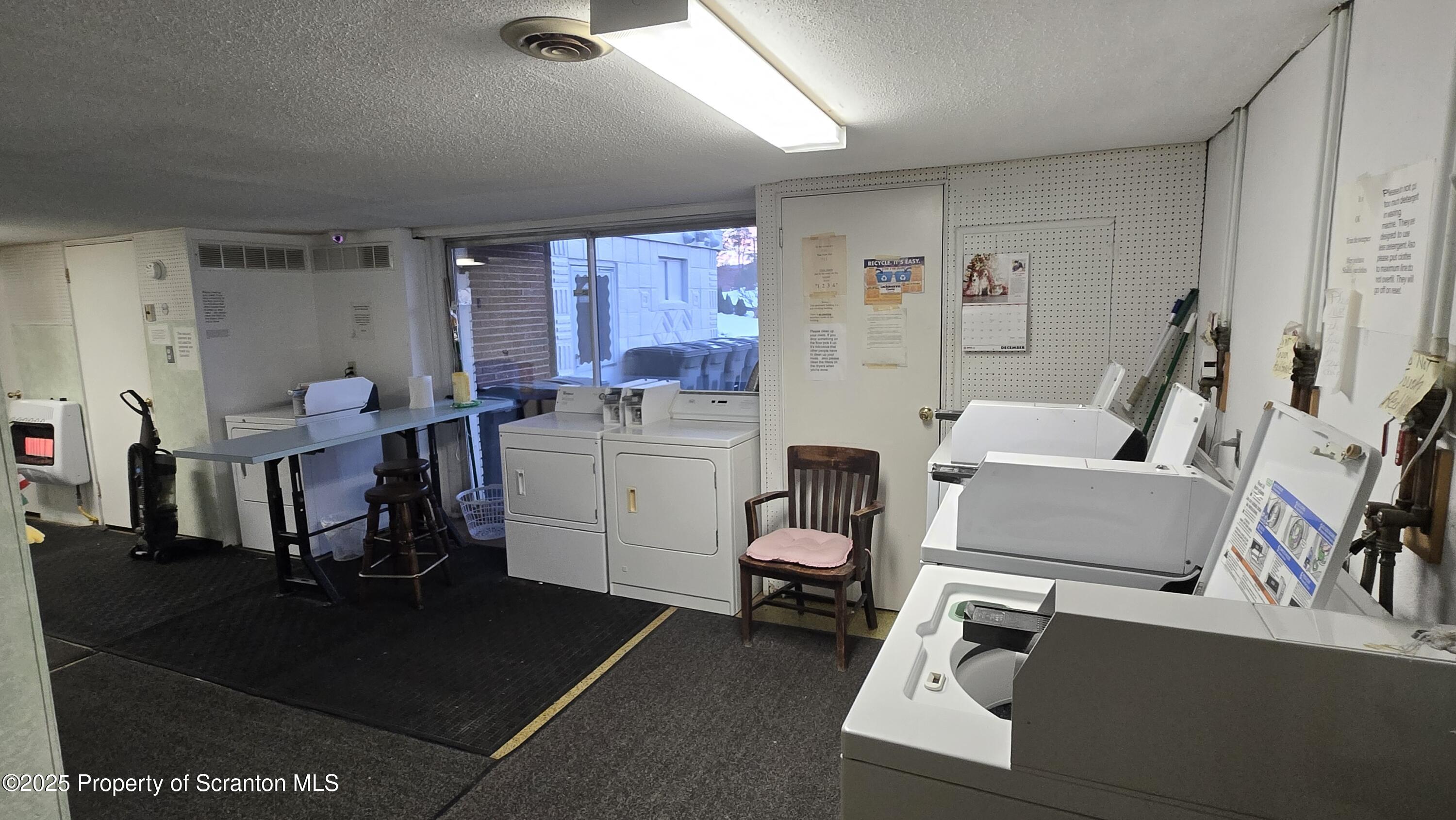 3730 Lawrence Avenue, Unit 7 Moosic, PA 18507 - Photo 9 of 10 a room with furniture a rug kitchen view and a window