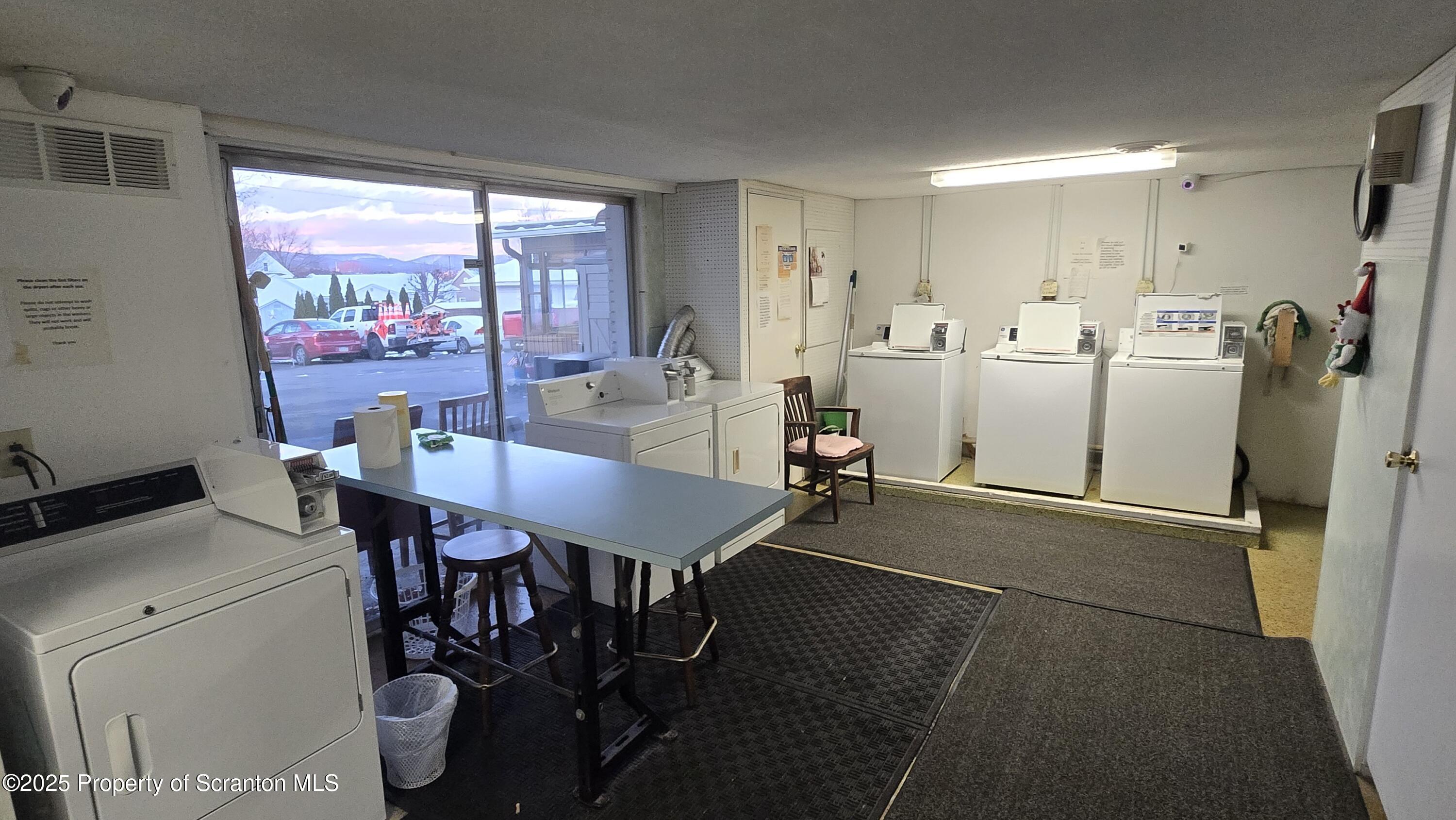 3730 Lawrence Avenue, Unit 7 Moosic, PA 18507 - Photo 10 of 10 a view of a dining room with furniture large window and glass door
