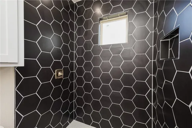 a bathroom with a sink and a shower