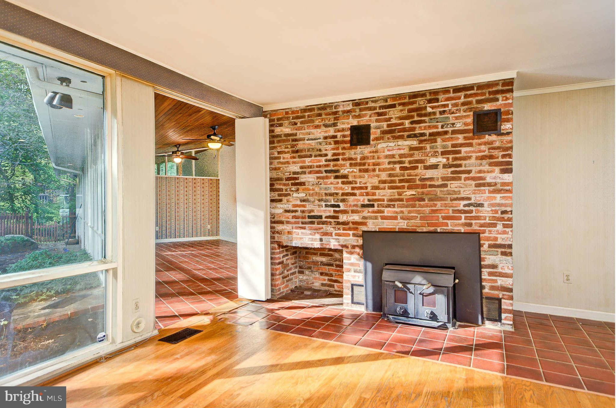 7308 Stafford Road Alexandria, VA 22307 - Photo 13 of 30 a view of living room and fireplace