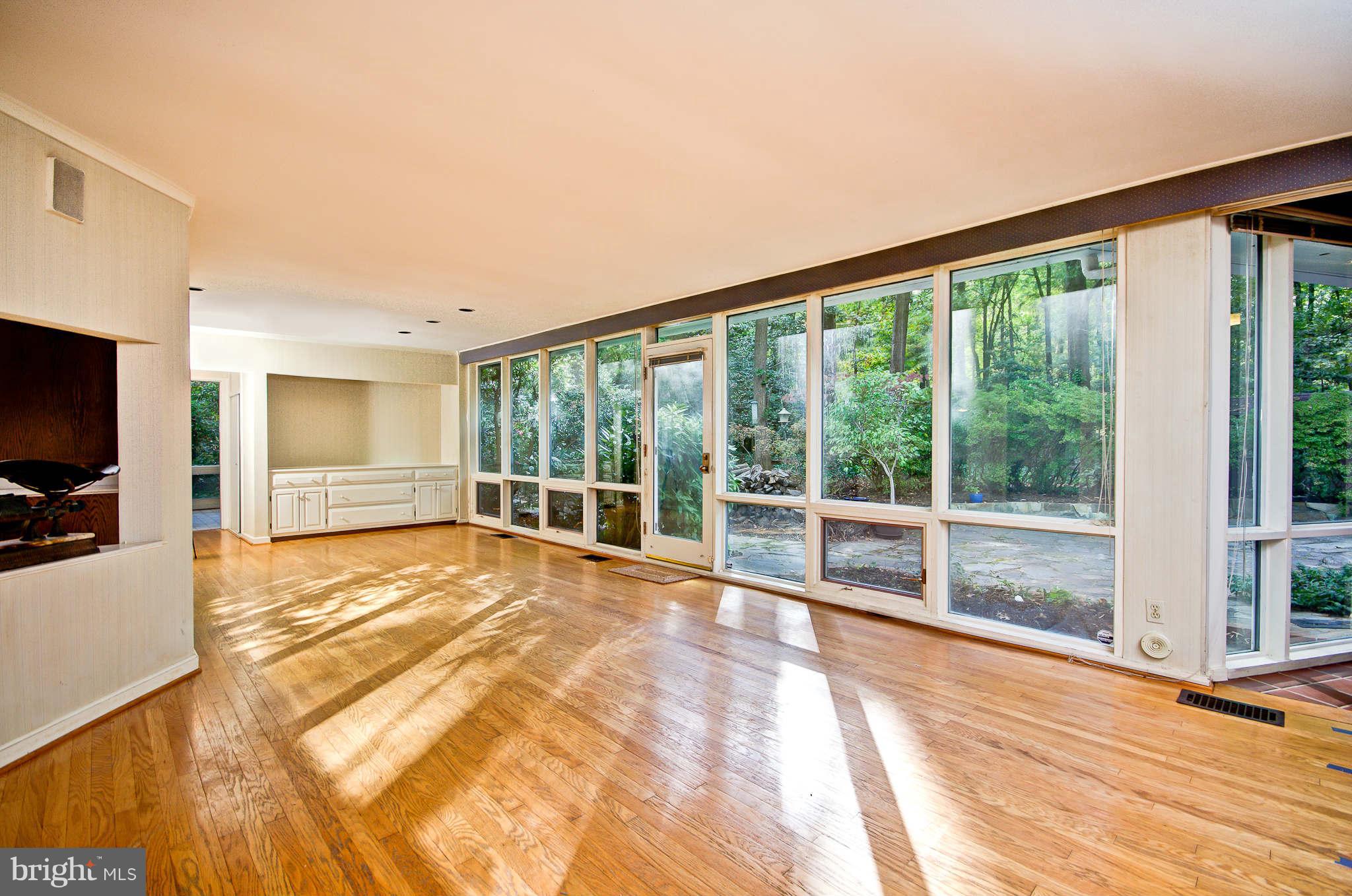 7308 Stafford Road Alexandria, VA 22307 - Photo 15 of 30 a view of an empty room with a window and wooden floor