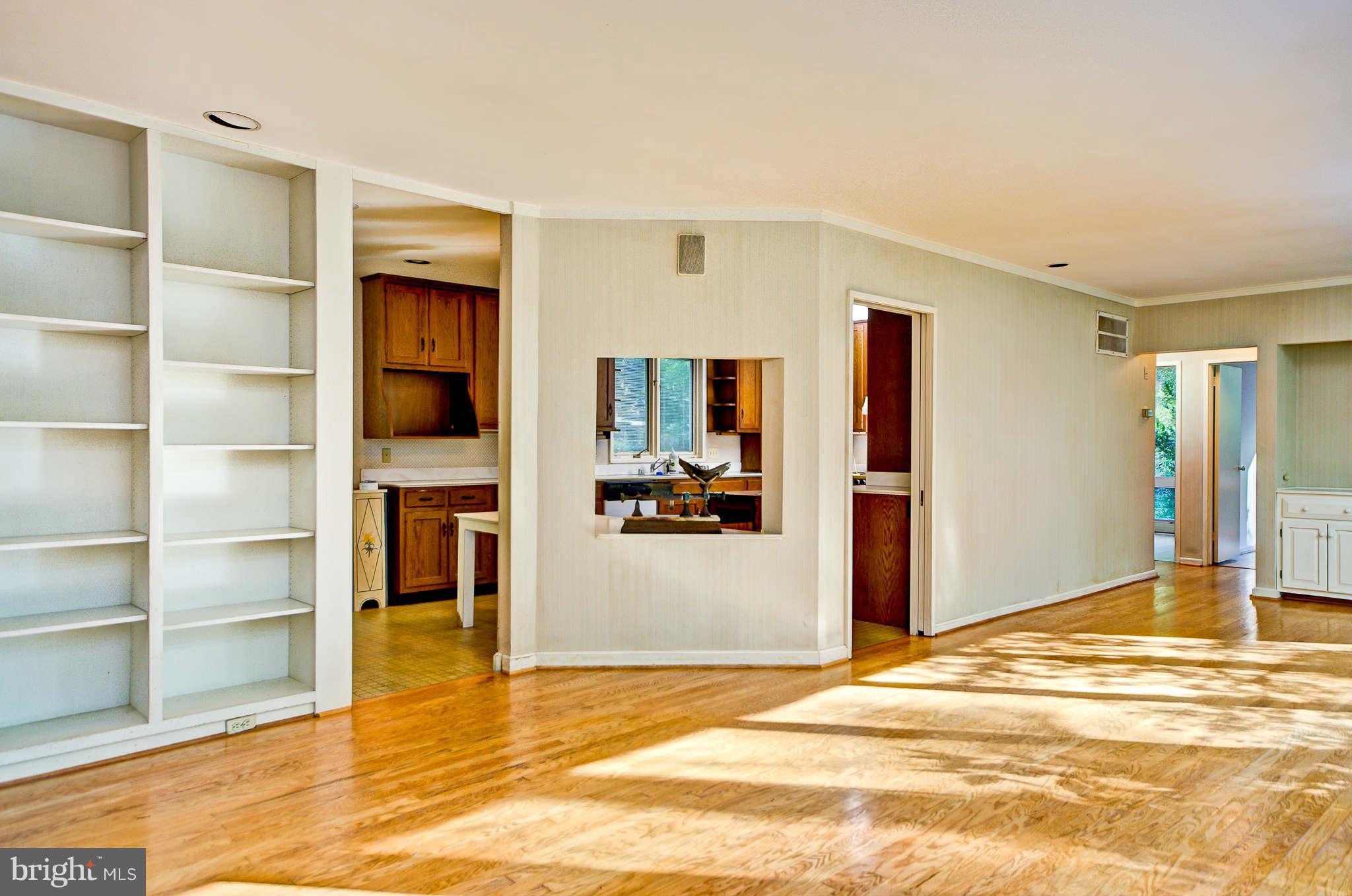 7308 Stafford Road Alexandria, VA 22307 - Photo 20 of 30 a view of a livingroom with wooden floor and a cabinet