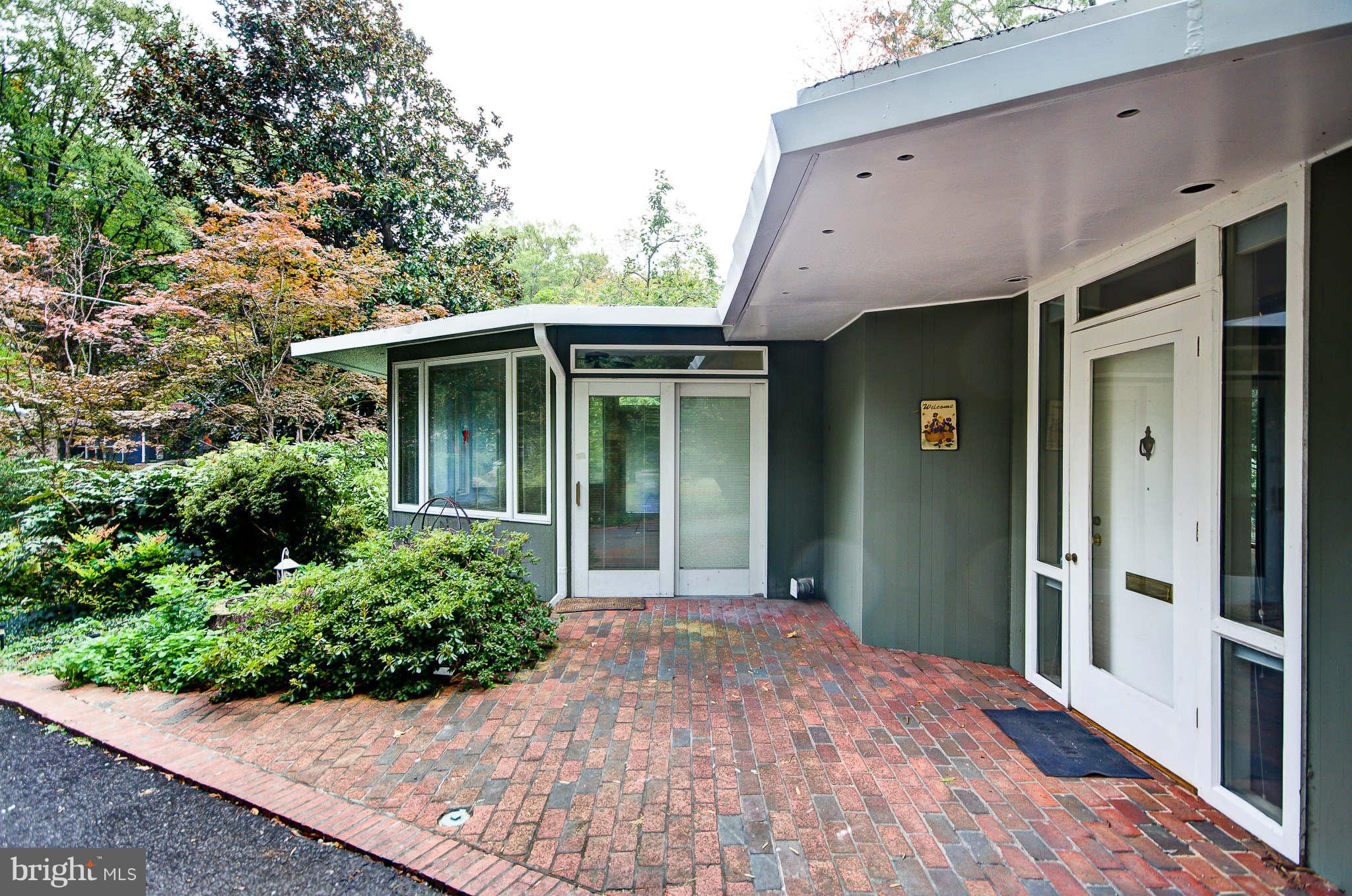 7308 Stafford Road Alexandria, VA 22307 - Photo 3 of 30 a front view of a house with garden