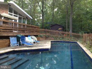 7308 Stafford Road Alexandria, VA 22307 - Photo 25 of 30 a view of house with outdoor space and sitting area