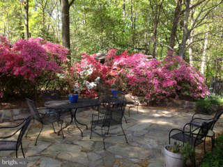 7308 Stafford Road Alexandria, VA 22307 - Photo 26 of 30 a patio with table and chairs and potted plants
