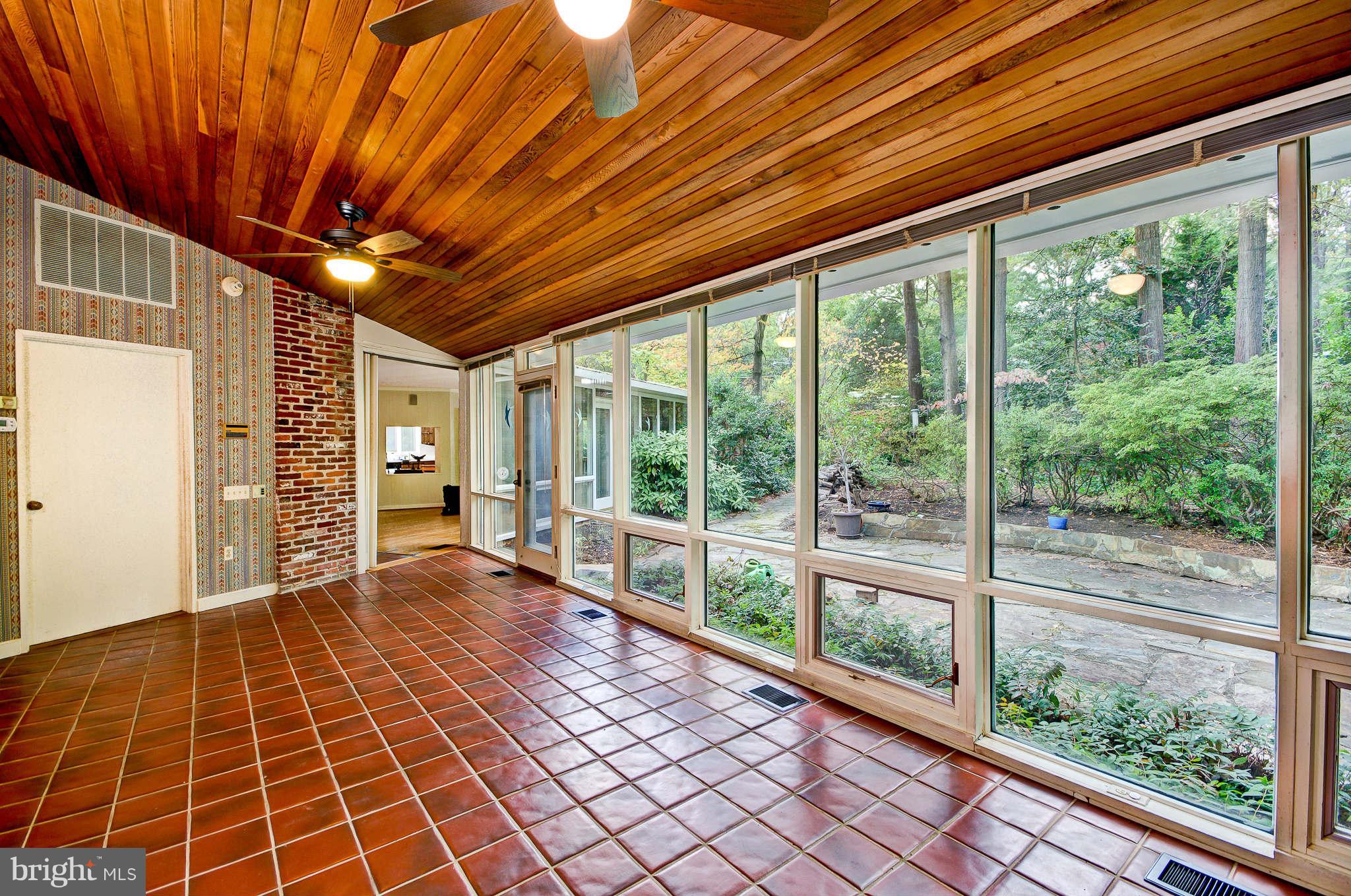 7308 Stafford Road Alexandria, VA 22307 - Photo 8 of 30 a view of empty room with wooden floor and windows