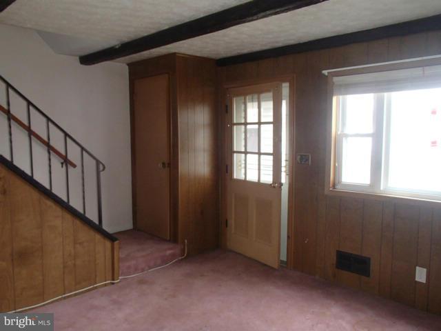 7651 Charlesmont Road Baltimore, MD 21222 - Photo 2 of 17 wooden floor in an empty room with a window