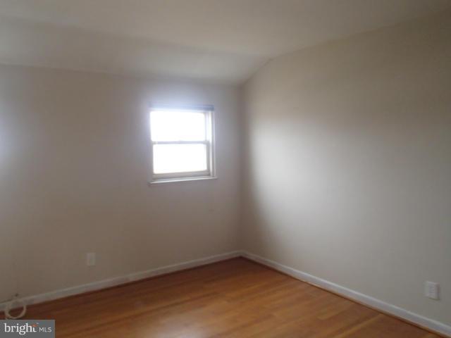 7651 Charlesmont Road Baltimore, MD 21222 - Photo 11 of 17 an empty room with a window
