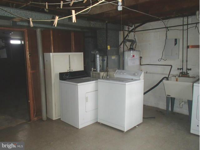 7651 Charlesmont Road Baltimore, MD 21222 - Photo 14 of 17 a utility room with dryer and washer