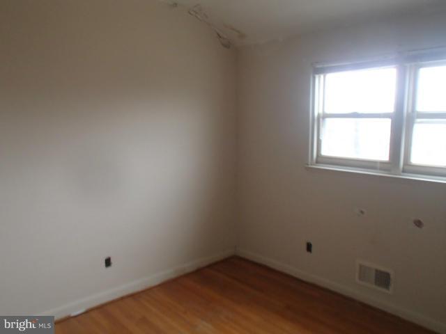 7651 Charlesmont Road Baltimore, MD 21222 - Photo 8 of 17 an empty room with a window