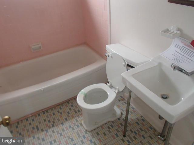 7651 Charlesmont Road Baltimore, MD 21222 - Photo 9 of 17 a bathroom with a sink and a toilet