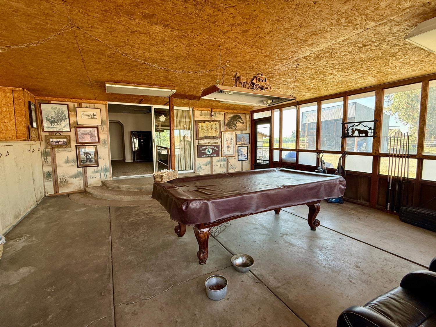 821 Orestimba Road Newman, CA 95360 - Photo 12 of 34 a balcony with furniture and wooden floor
