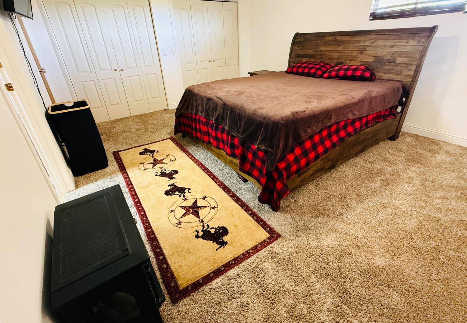 821 Orestimba Road Newman, CA 95360 - Photo 14 of 34 a bed sitting in a bedroom next to a window